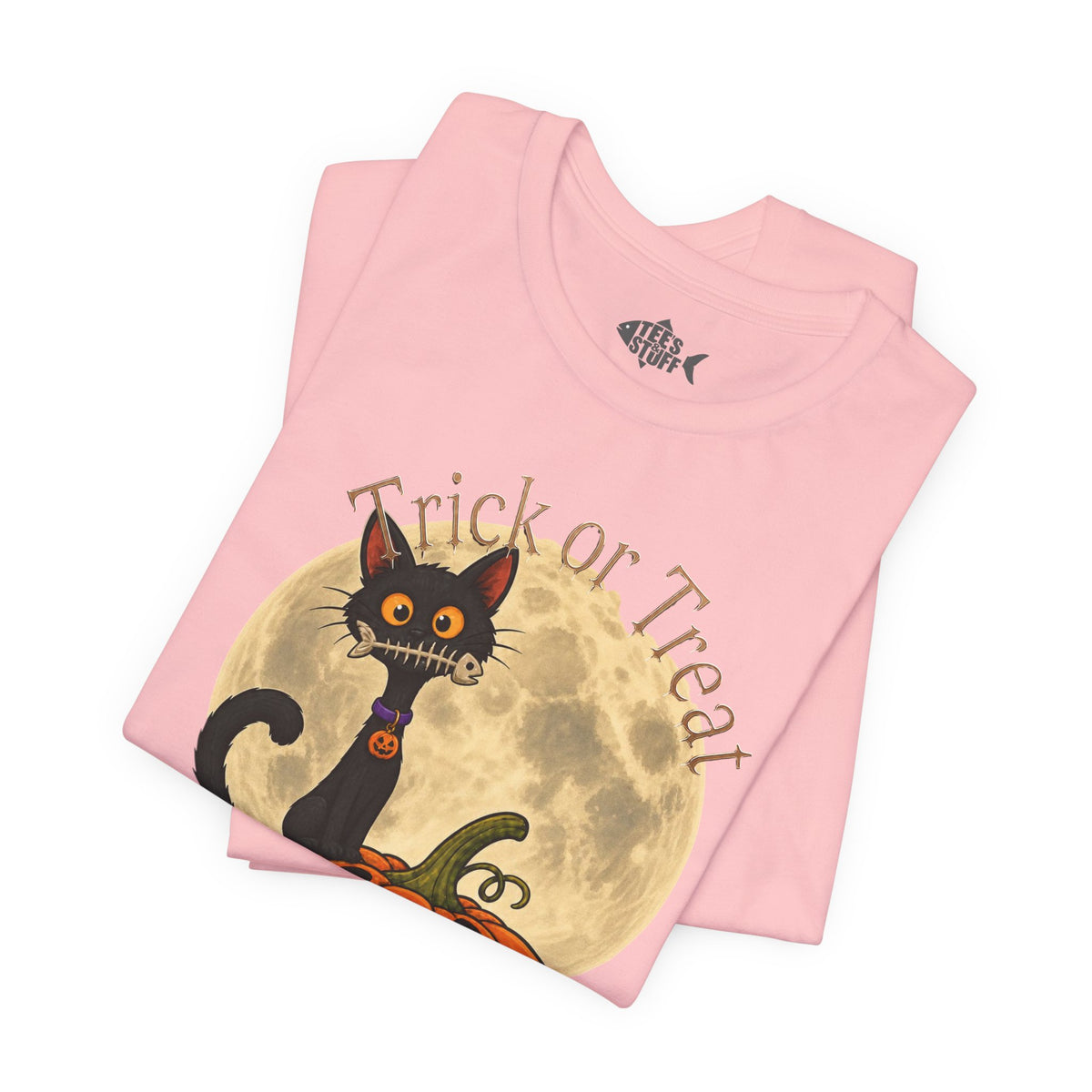 Folded light pink Halloween Trick or Treat T-shirt showing black cat full moon and candy pail.